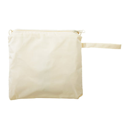 Reversible Rain Poncho in Wild Flowers Closed in Carrying Pouch