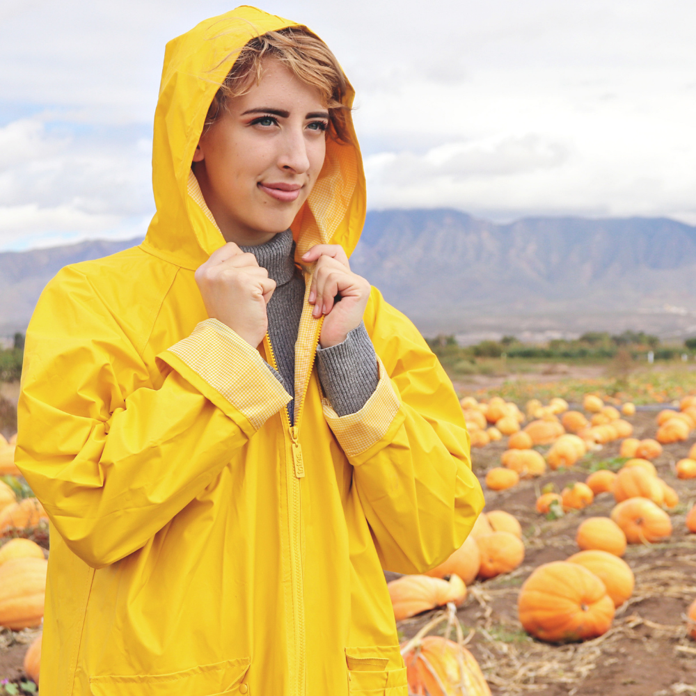 Yellow rain slicker on figure at a pumpkin patch