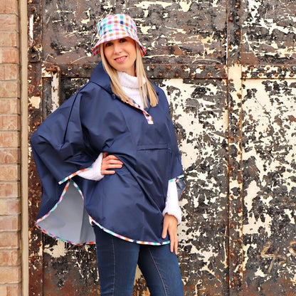 Reversible Rain Poncho in Rainbow Gingham On Model with Bucket Hat