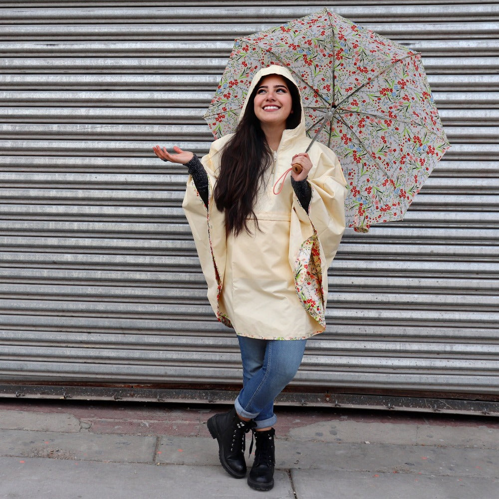 Reversible Rain Poncho in Wild Flowers Right On Model with Umbrella